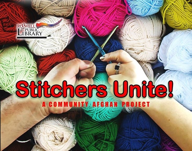 knitters hands crossing in front of spools of yarn