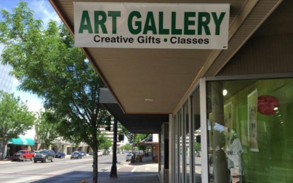 A picture of a sign for "The Gallery" off of main street Roswell, NM.