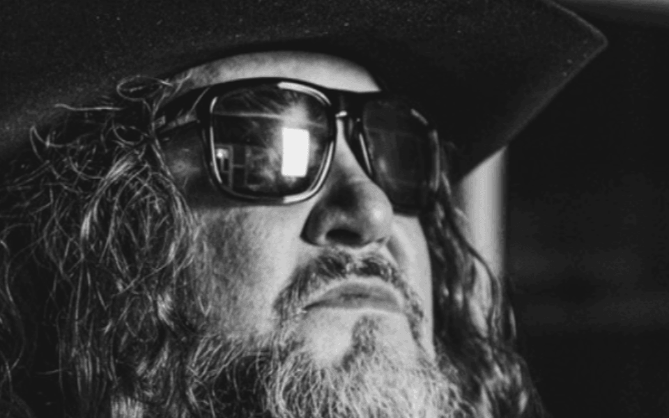 Sundance Head member pictured in black and white facing towards the right.